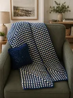 Crochet blue and white blanket with a crochet blue pillow
