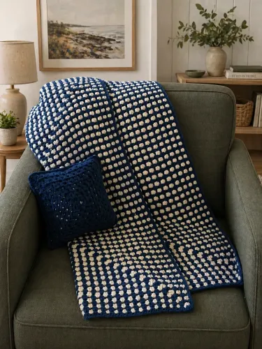 Crochet blue and white blanket with a crochet blue pillow